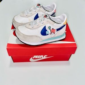 White Blue and Yellow baby Nike Shoes 7c